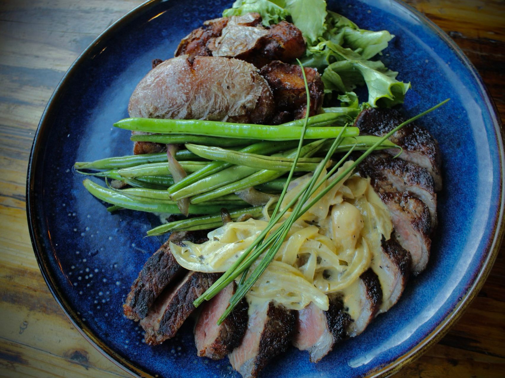Pepper-Rosemary Grilled 10 Oz NY Strip Steak.