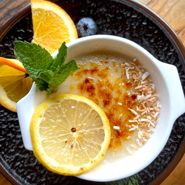 Bandaloop's healthy dessert, a creme brulee with toasted coconut, lemon, orange, and mint garnish.